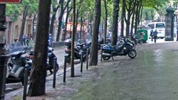 Paris motorcycle parking sidewalk